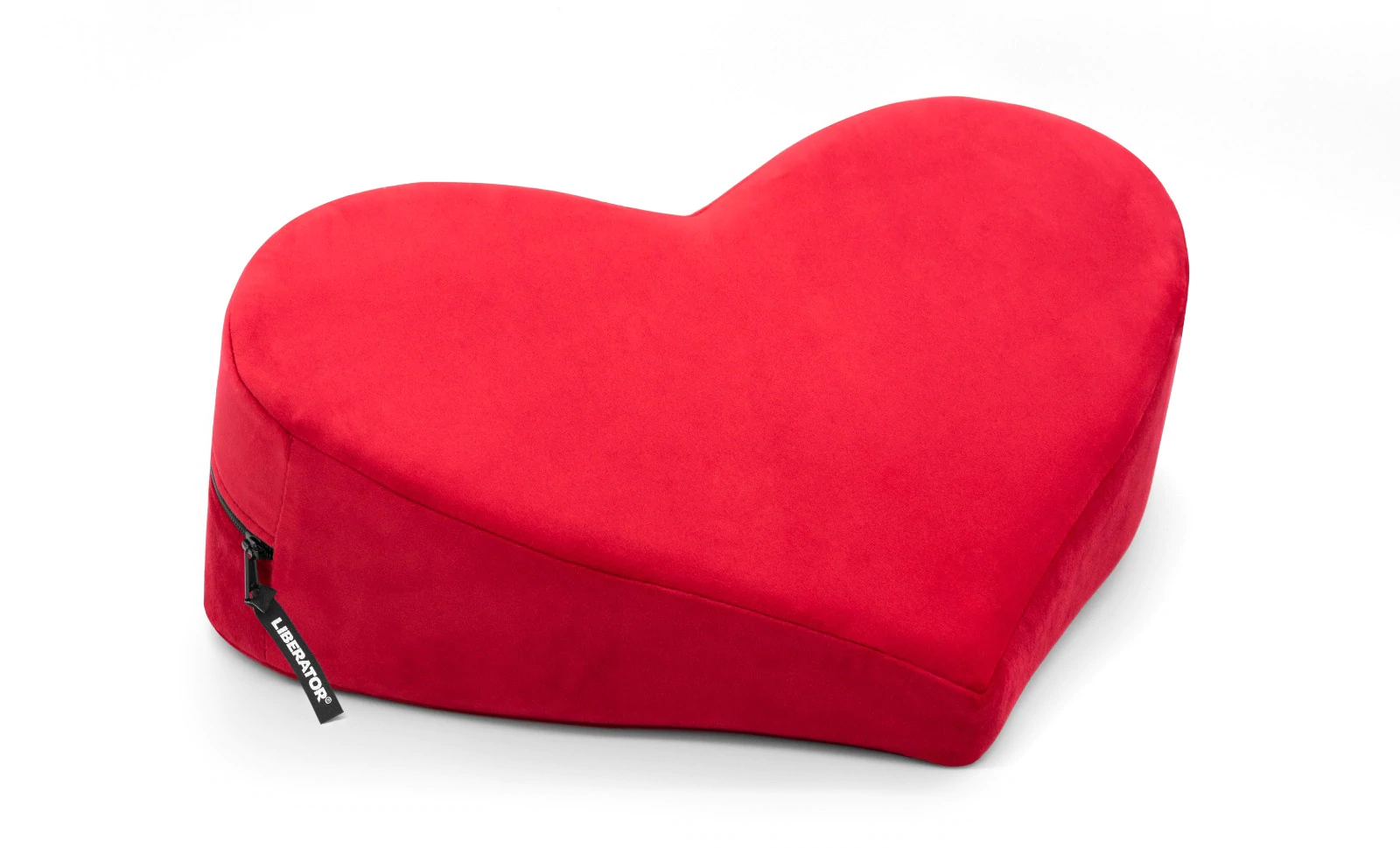 Red heart-shaped microvelvet positioning pillow with a zipper.