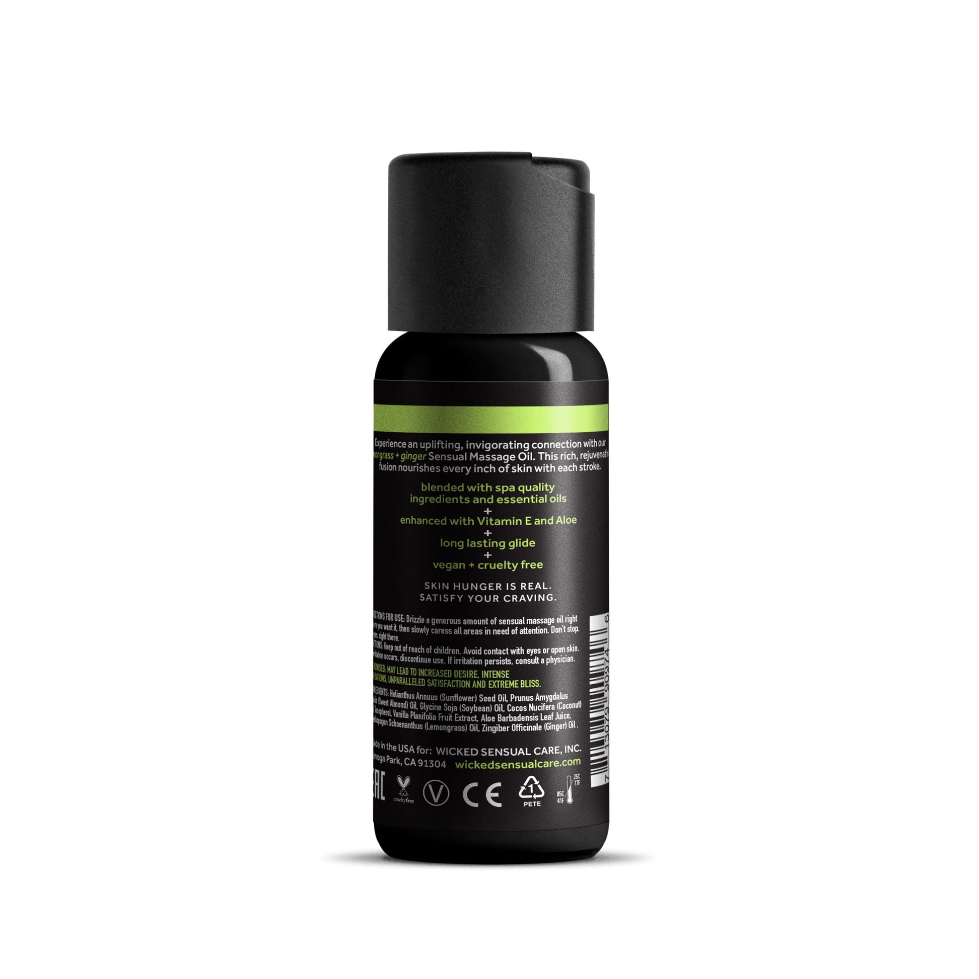 A bottle of Lemongrass & Ginger Sensual Massage Oil with Vitamin E.