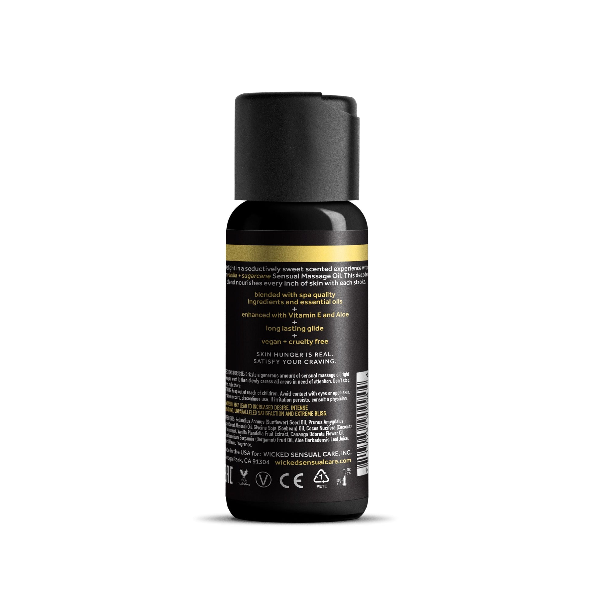 A bottle of vanilla and sugarcane sensual massage oil with Vitamin E and Aloe.