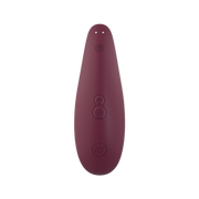 Womanizer Bordeaux clitoral stimulator with power and intensity buttons.