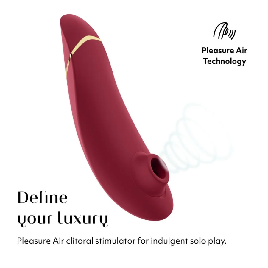 A maroon clitoral vibrator with gold accents and "Pleasure Air Technology" text.