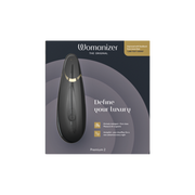 Womanizer Premium 2 clitoral vibrator in black with gold accents.