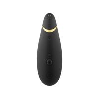 Black Womanizer Premium 2 clitoral vibrator with gold accent and buttons.
