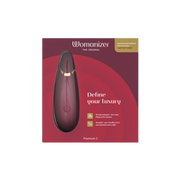 Womanizer Premium 2 clitoral vibrator in a deep red color.