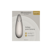 Womanizer Premium 2 clitoral vibrator in a sleek, metallic finish.
