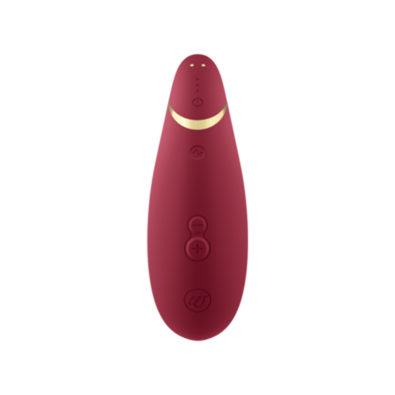 A deep red clitoral vibrator with gold accents and control buttons.