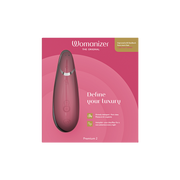 Womanizer Premium 2 clitoral vibrator in pink with text "Define your luxury".