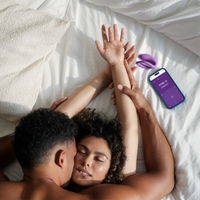 Purple C-shape couples vibrator with a smartphone app.