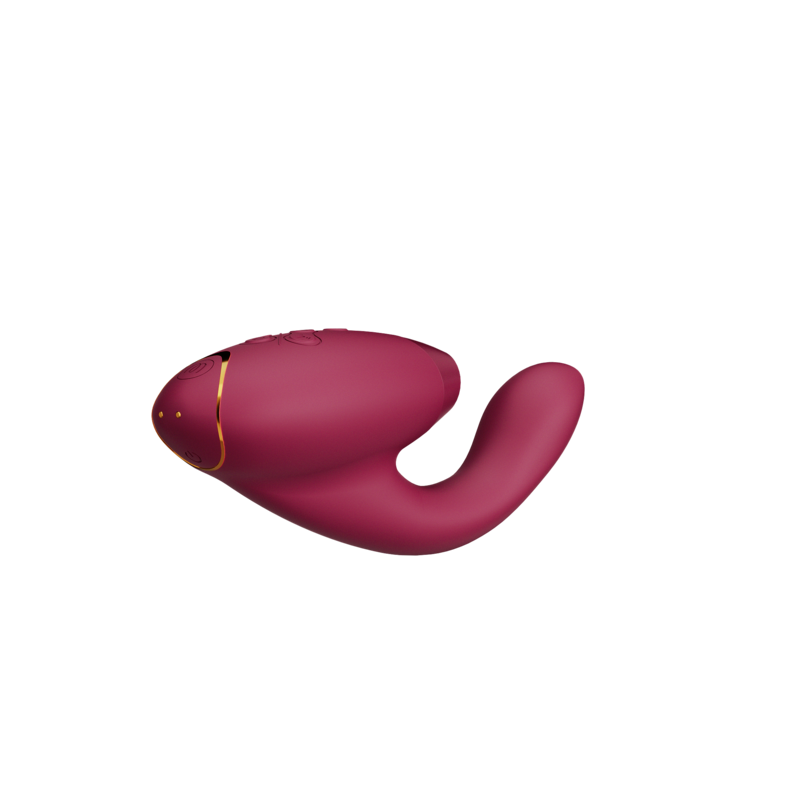 A pink rabbit vibrator with gold accents and textured patterns.