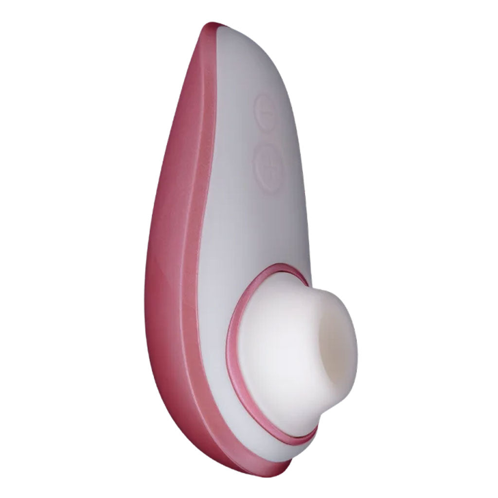Pink and white clitoral stimulator with a white silicone tip.