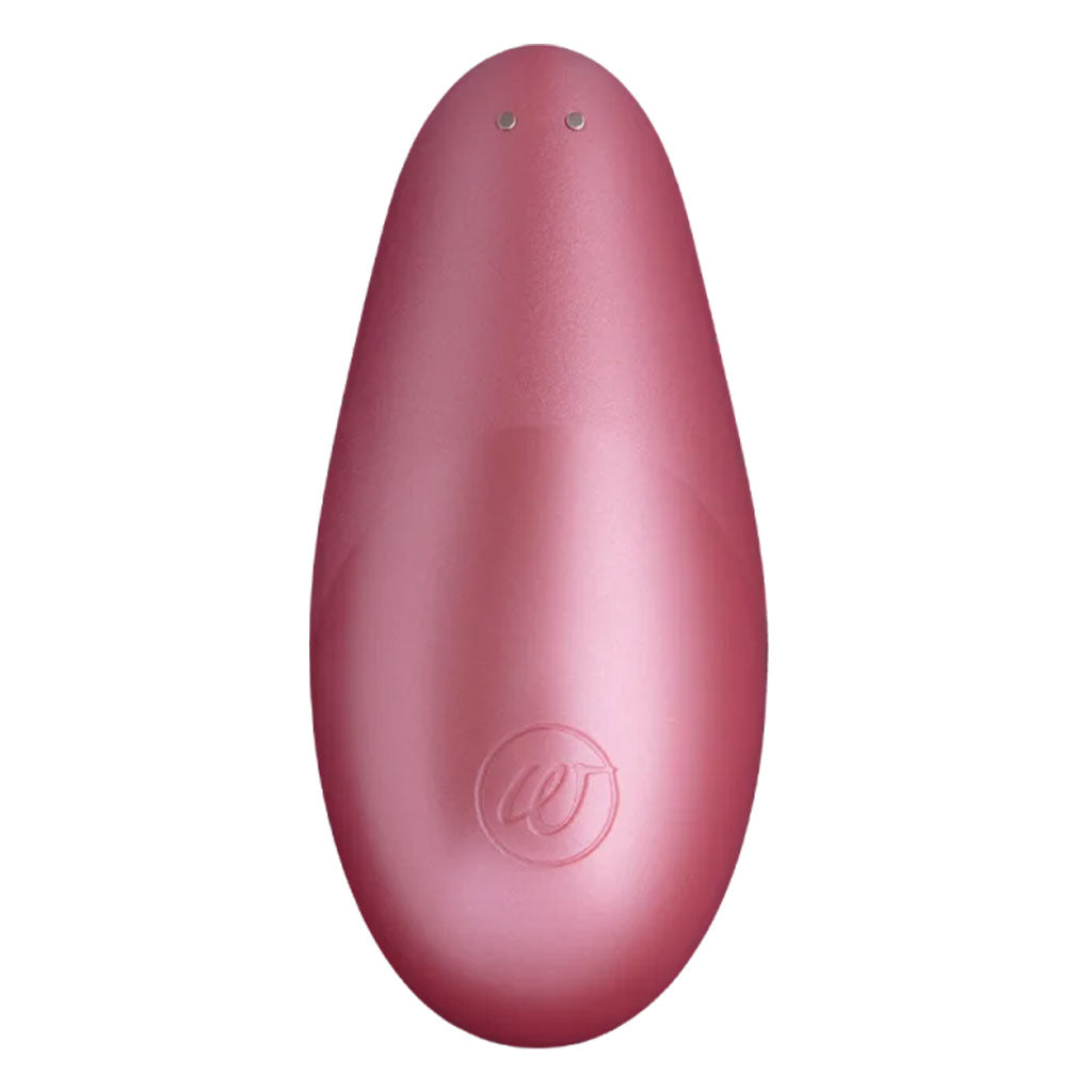 Pink rose Womanizer Liberty clitoral stimulator with two small circles at the top.