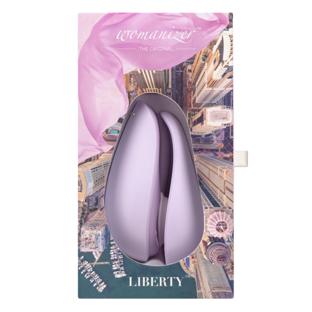 Lilac Womanizer Liberty clitoral stimulator in packaging with city background.