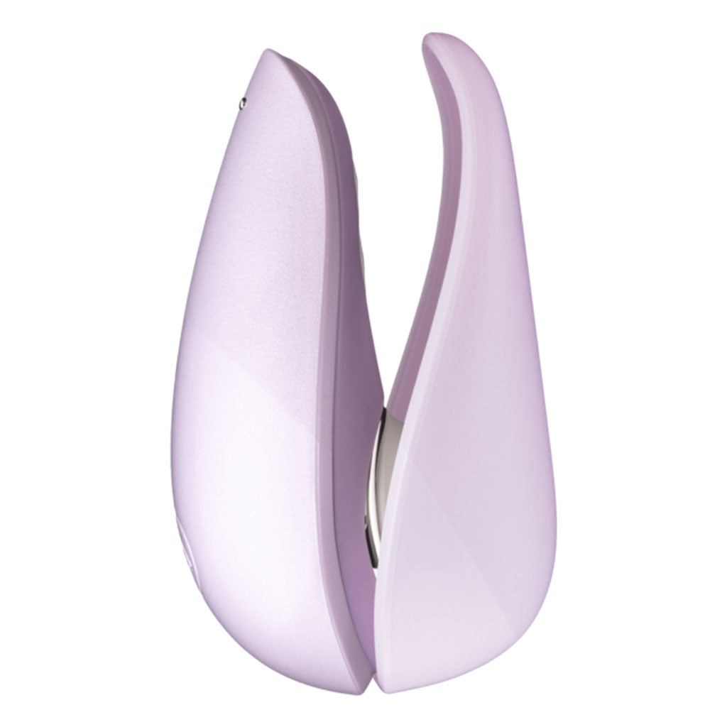 A lilac clitoral stimulator with two curved, petal-like sides.