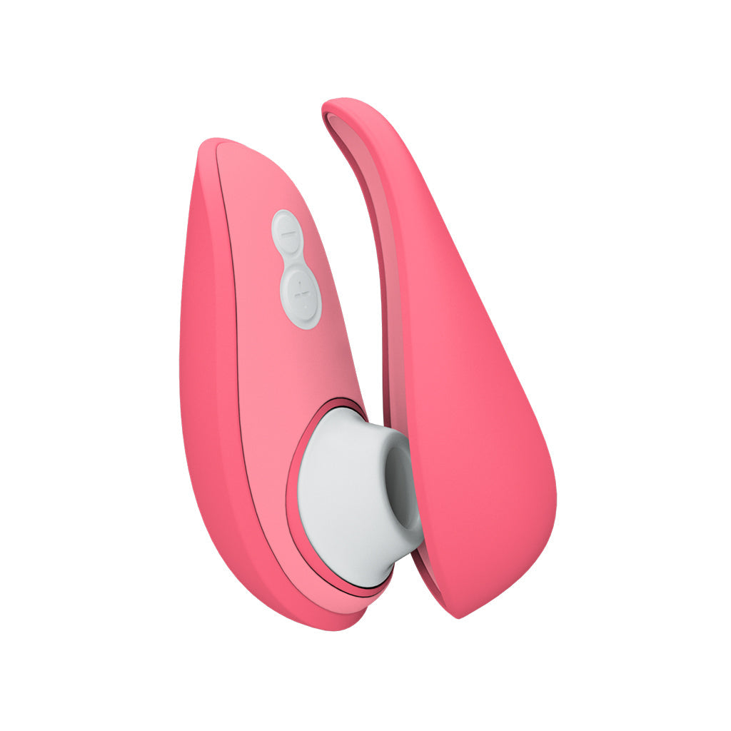 A pink Womanizer Liberty 2 clitoral stimulator with white buttons and a white silicone opening.