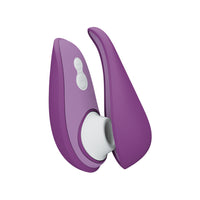 Purple clitoral stimulator with two curved arms and white buttons.
