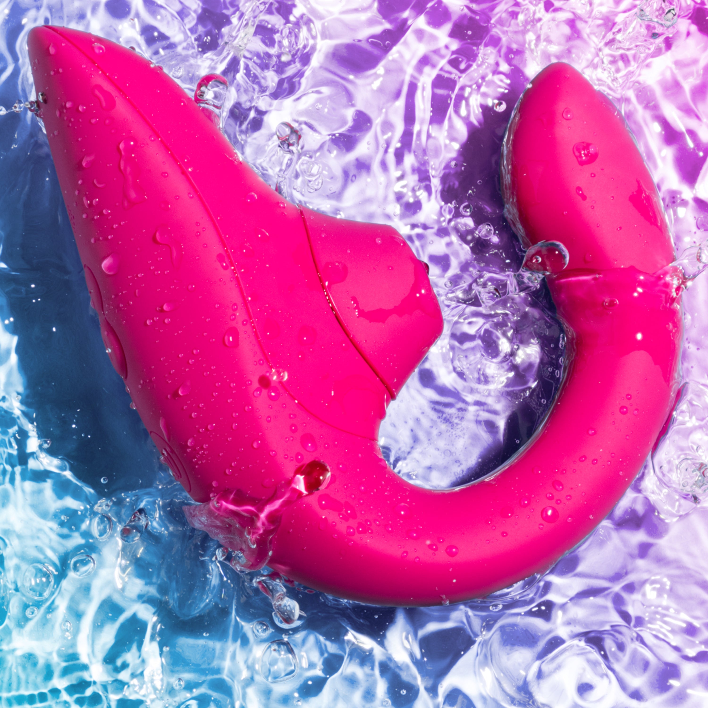 A vibrant pink dual stimulation rabbit vibrator with water splashes.
