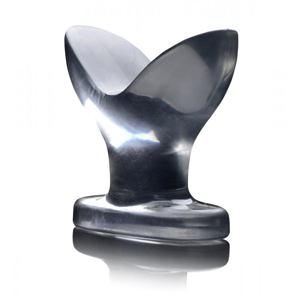 Clear anal plug with a flared, anchored design and a TPR base.