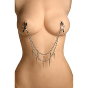 Silver double chain nipple clamps with spikes on a mannequin torso.