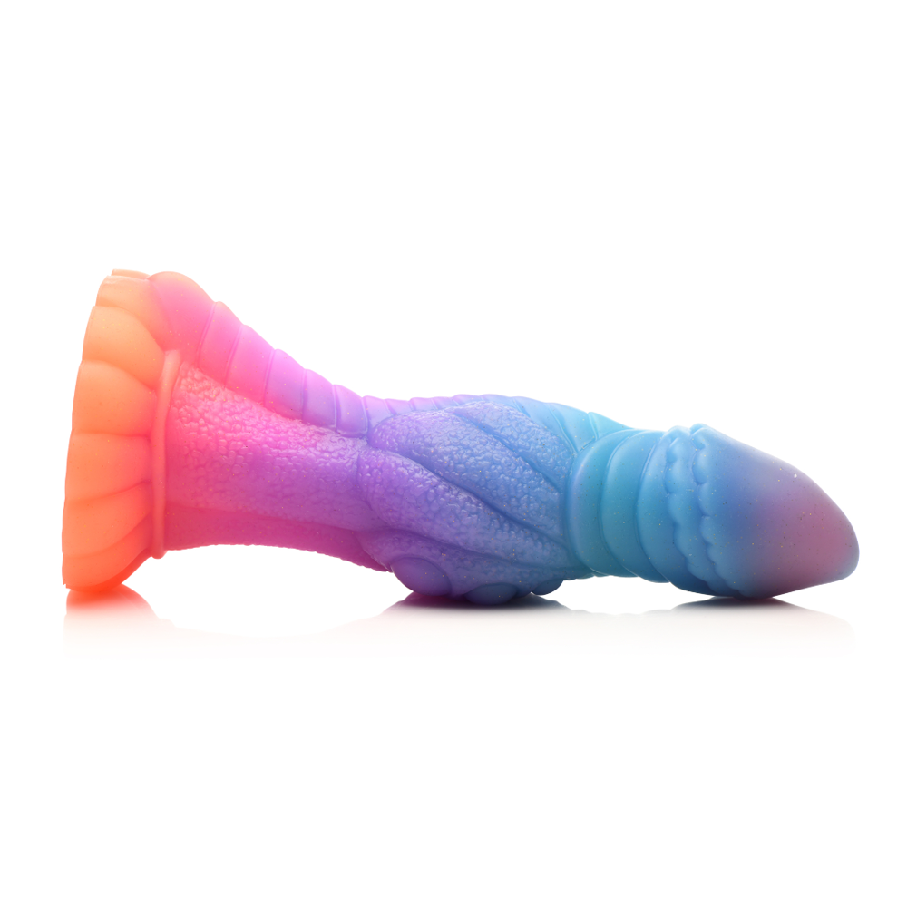 A glow-in-the-dark silicone dildo with a suction cup base and a textured, multi-colored design.