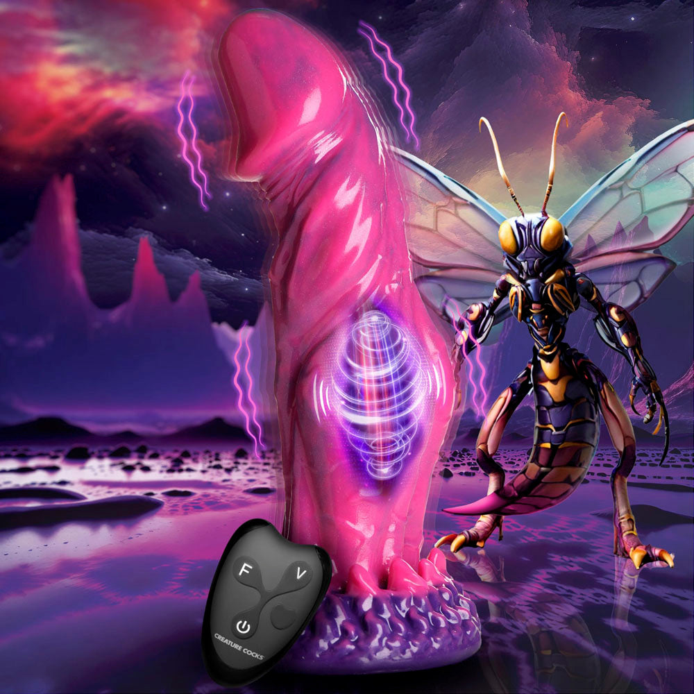 Pink silicone fantasy dildo with remote control and insectoid creature.