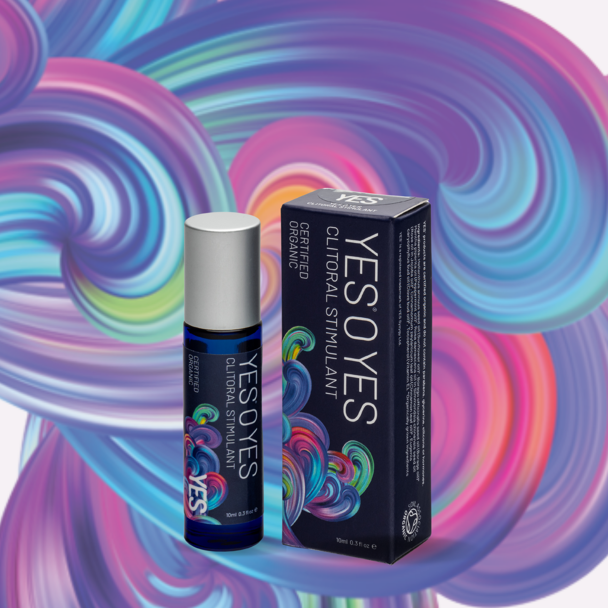 A rollerball bottle and box of YES O YES Organic Clitoral Stimulant Oil on a colorful background.